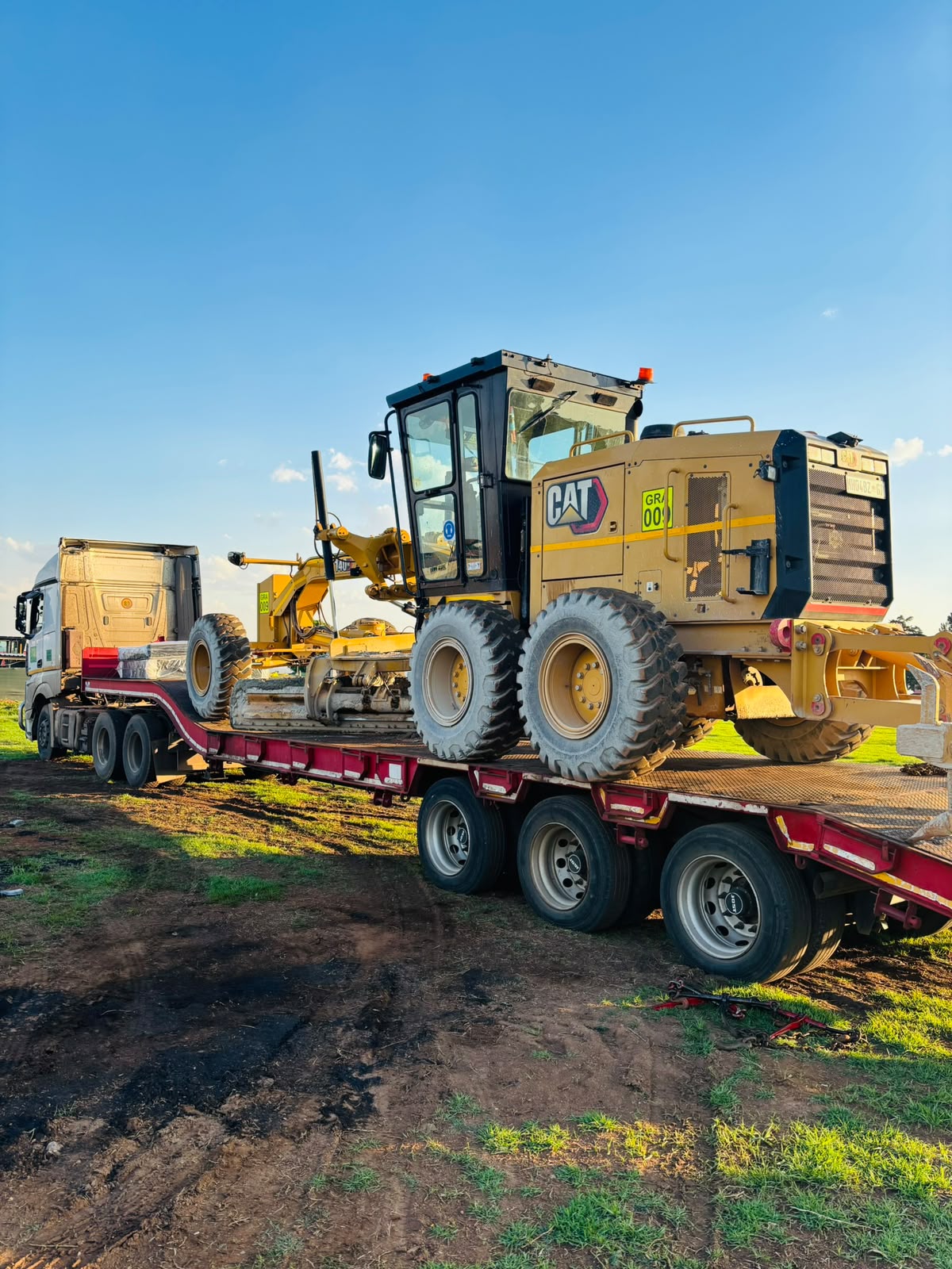 CAT Grader loaded for transport to site