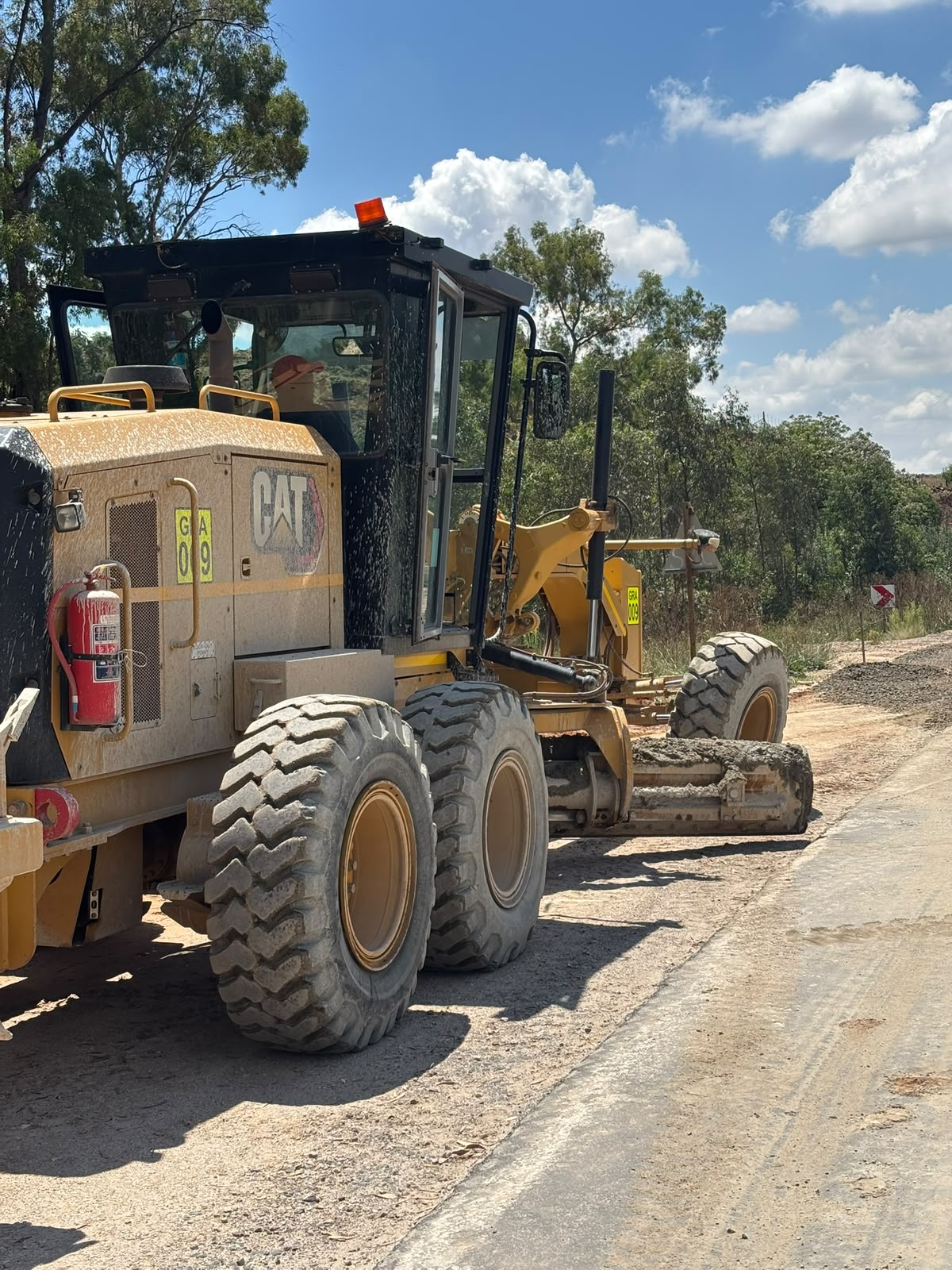 CAT 140 Grader on site